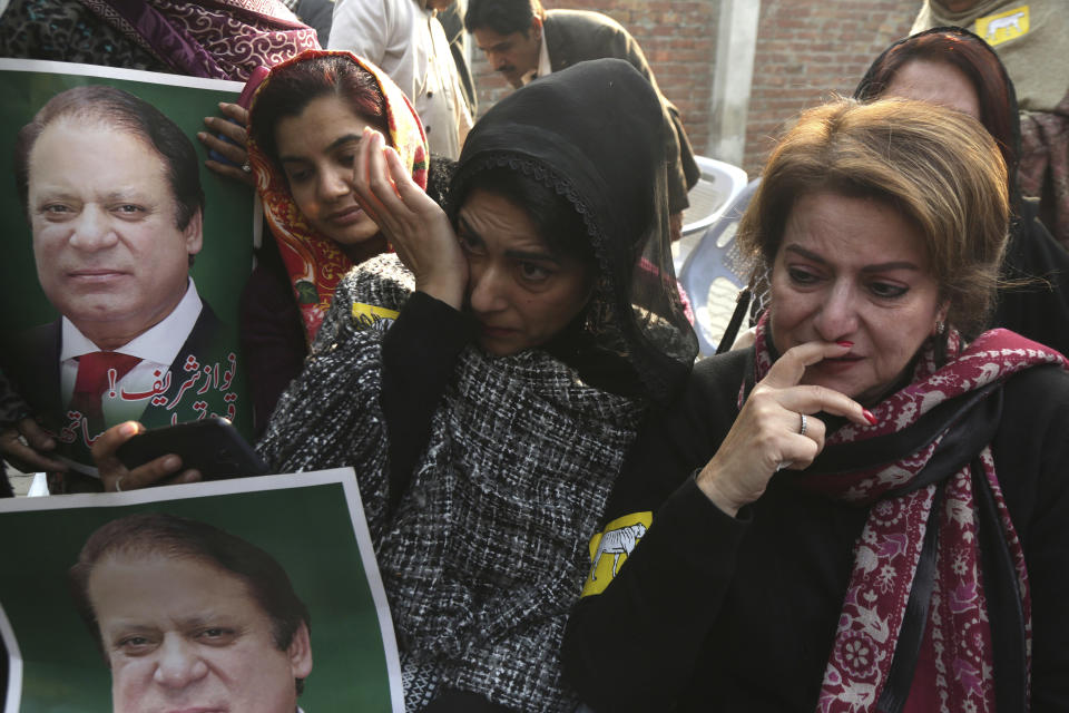 Grieving supporters of former Pakistani Prime Minister Nawaz Sharif protest against a court ruling in Lahore, Pakistan, Monday, Dec. 24, 2018. An anti-graft tribunal sentenced Sharif to seven years in prison for corruption on Monday, drawing criticism from his party, which said the decision was a "black stain" on the justice system. The same court acquitted Sharif in a second case relating to his family's business in Britain. (AP Photo/K.M. Chaudary)