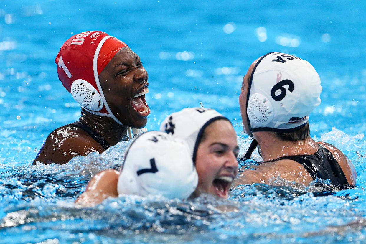 Ashleigh Johnson and her team celebrate in the water. (Adam Nurkiewicz / Getty Images file)