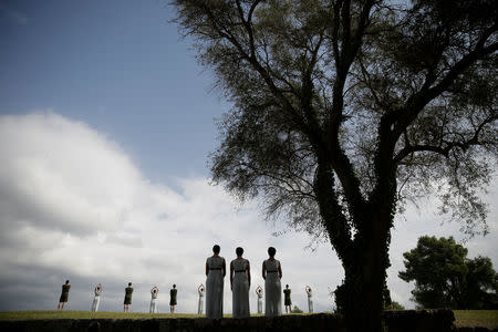 Olympics - Dress Rehearsal - Lighting Ceremony of the Olympic Flame Pyeongchang 2018 - Ancient Olympia, Olympia, Greece - October 23, 2017 Actors perform during the dress rehearsal for the Olympic flame lighting ceremony for the Pyeongchang 2018 Winter Olympic Games at the site of ancient Olympia in Greece REUTERS/Alkis Konstantinidis