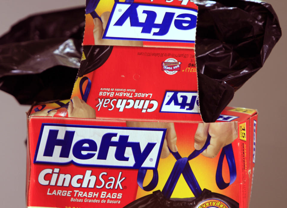 In this posed photo, a box of opened Hefty trash bags is seen in West Bath, Maine, on Tuesday, August 17, 2010. Global packaging company Reynolds Group said Tuesday, Aug. 17, it's agreed to pay about $4.4 billion for Pactiv, maker of the Hefty brand trash bags. (AP Photo/Pat Wellenbach)