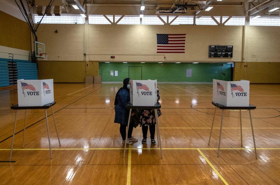 PHOTO: Residents of Lansing, Michigan, cast their votes Nov. 3, 2020.  (Seth Herald/AFP via Getty Images)