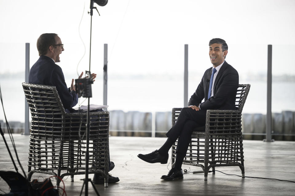 Britain's Prime Minister Rishi Sunak, center, during a media interview in San Diego, Monday March 13, 2023, ahead of his meetings with US President Joe Biden and Prime Minister of Australia Anthony Albanese as part of Aukus, a trilateral security pact between Australia, the UK, and the US. (Leon Neal/Pool via AP)