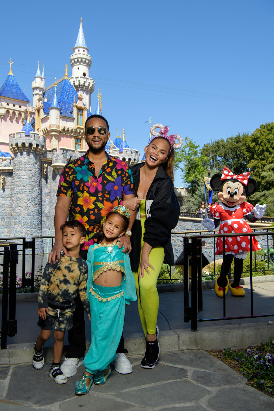 ANAHEIM, CALIFORNIA - APRIL 14: In this handout photo provided by Disneyland Resort, John Legend, Chrissy Teigen and their children, Miles and Luna pose with Minnie Mouse while celebrating Luna’s birthday at Disneyland on April 14, 2022 in Anaheim, California. (Photo by Richard Harbaugh/Disneyland Resort via Getty Images)