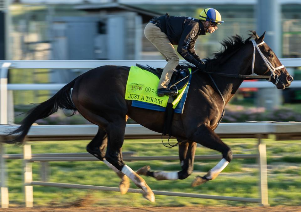 Kentucky Derby hopeful Just a Touch gallops on the track at Churchill Downs.