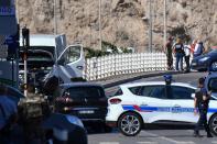 <p>French forensic police officers and security personnel gather near a vehicle following a car crash in the southern Mediterranean city of Marseille on Aug. 21, 2017. (Photo: Bertrand Langlois/AFP/Getty Images) </p>