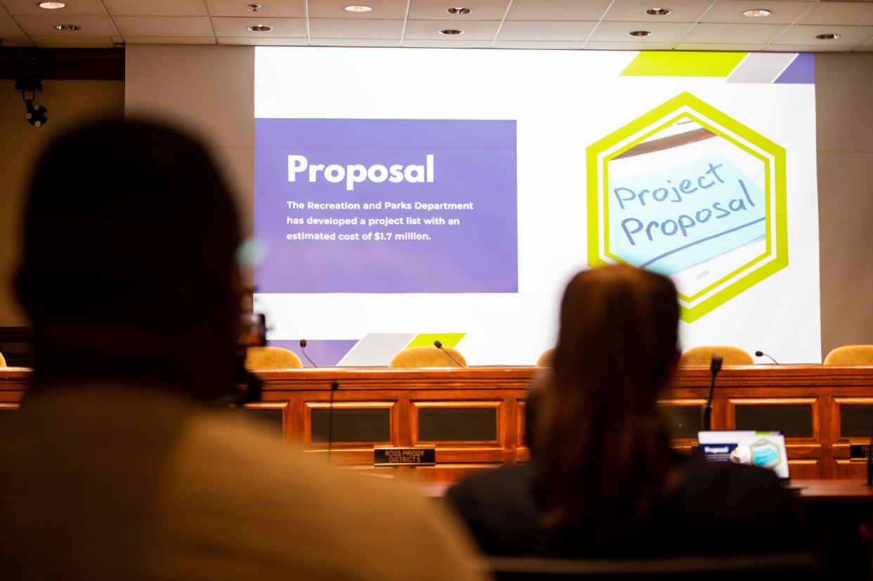 Audience attendees watch as Parks Operation Manager Christi David introduces a list of proposals during the Jackson Recreation and Parks Public Forums inside Jackson City Hall on Tuesday, Apr. 11, 2023.