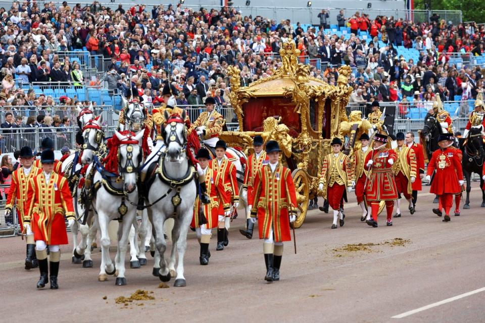 The Gold State Coach passes in front of Buckingham Palace during the Platinum Jubilee Pageant (PA)