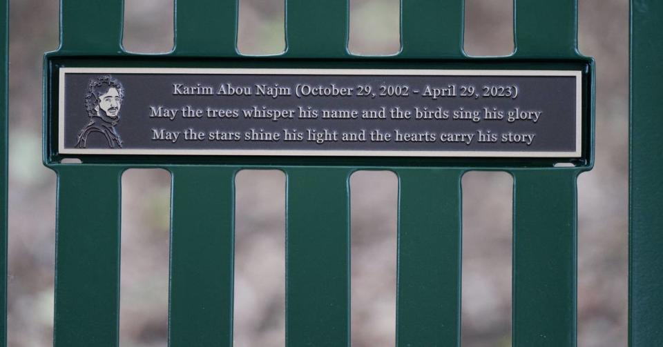 A plaque with the likeness of UC Davis student Karim Abou Najm is unveiled on Monday, the one-year anniversary of his fatal stabbing, on a bench at Sycamore Park in Davis.