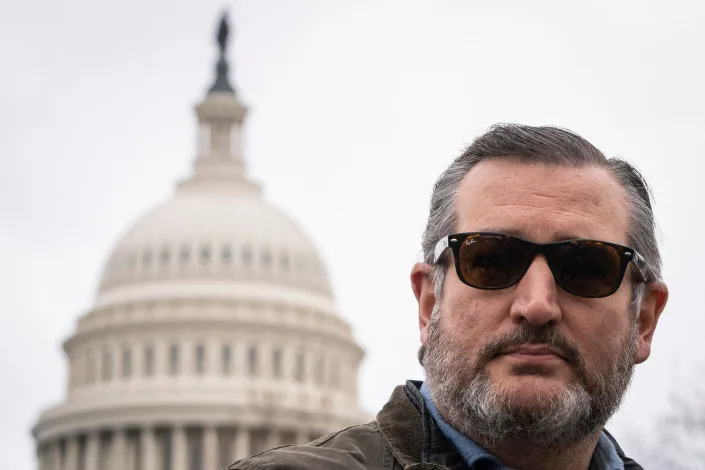 Republican Sen. Ted Cruz of Texas, poses for a picture while wearing sunglasses outside the US Capitol.