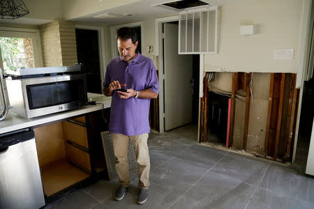 Resident Joel Loshak discusses damage as a result of Hurricane Harvey in Houston, Texas, U.S. November 12, 2017. Picture taken November 12, 2017. REUTERS/William Philpott