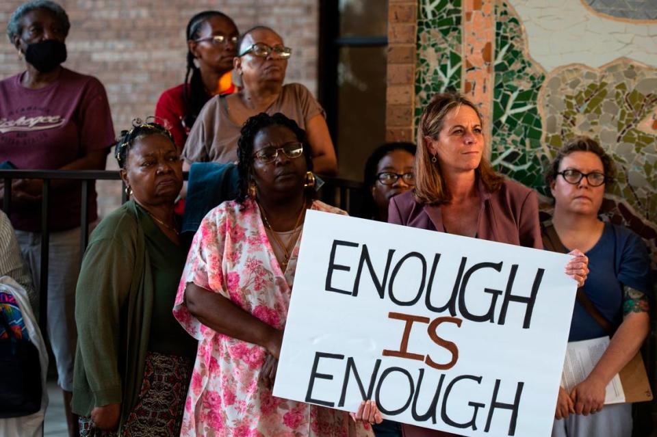 Members of We Shall Not Be Moved, a group protesting a proposed urban renewal plan for the city of Ocean Springs, stand outside the city Civic Center on Wednesday, Sept. 20, 2023.