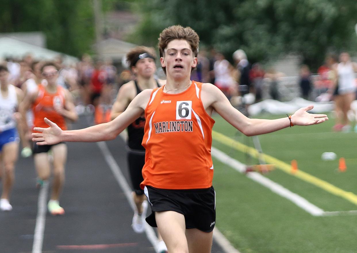 Marlington's Colin Cernansky crosses the finish line in first place in the boys 1600 meter final at the Division II track and field regional finals held at Austintown Fitch High School, Saturday, May 28, 2022.