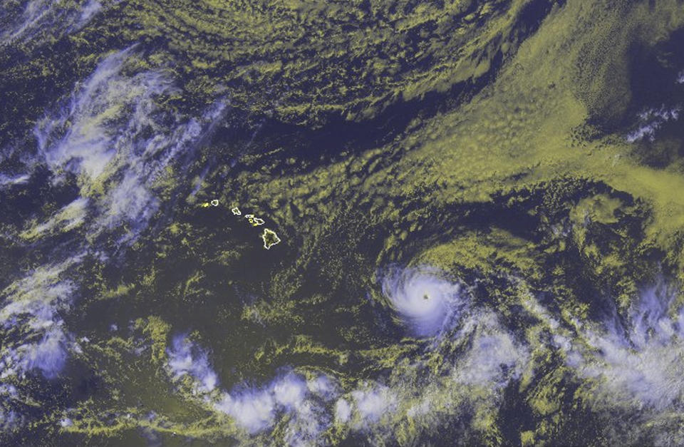 In this satellite image provided by the National Oceanic and Atmospheric Administration, the eye of Hurricane Hector can be seen as the storm moves toward Hawaii, Tuesday, Aug. 7, 2018, at 00:30 UTC. A tropical storm watch was in effect Monday, Aug. 6 for waters south of the Big Island as Hector was expected to pass Tuesday night and Wednesday as it moved westward. (NOAA via AP)