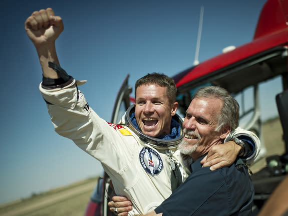 Skydiver Felix Baumgartner of Austria and Technical Project Director Art Thompson of the Unites States celebrate after successfully completing the world's highest skydive, a supersonic leap, for Red Bull Stratos in Roswell, New Mexico, on Oct.