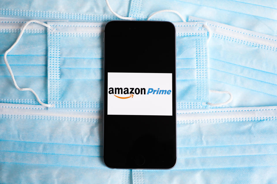 Amazon Prime logo is displayed on a mobile phone screen photographed on surgical masks background for illustration photo during the spread of coronavirus. Krakow, Poland on April 26, 2020.  (Photo Illustration by Beata Zawrzel/NurPhoto via Getty Images)