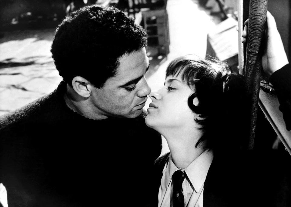 Paul Danquah and Rita Tushingham lean in to kiss