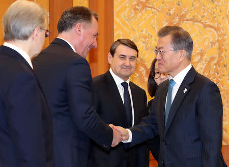 South Korean President Moon Jae-in greets delegation of the Olympic Athletes from Russia during their meeting at the Presidential Blue House in Seoul, South Korea, February 20, 2018. Yonhap/via REUTERS