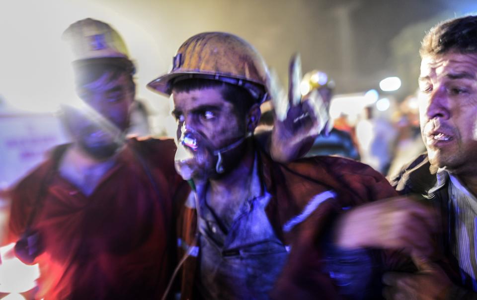 An injured miner came out carried by rescuers, on May 13, 2014 after an explosion in a coal mine in Manisa. (BULENT KILIC/AFP/Getty Images)