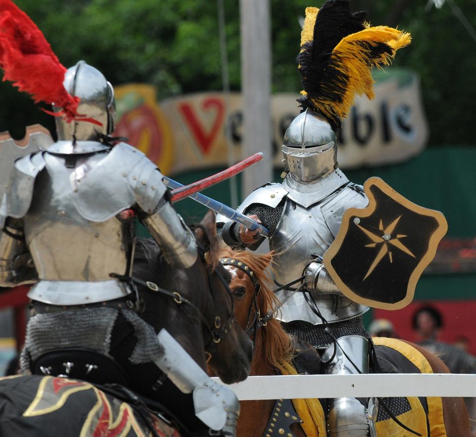 Sir Mauldron (left) does battle with Sir Maxmillian during the jousting competition on July 5, 2014, at the Bristol Renaissance Faire.