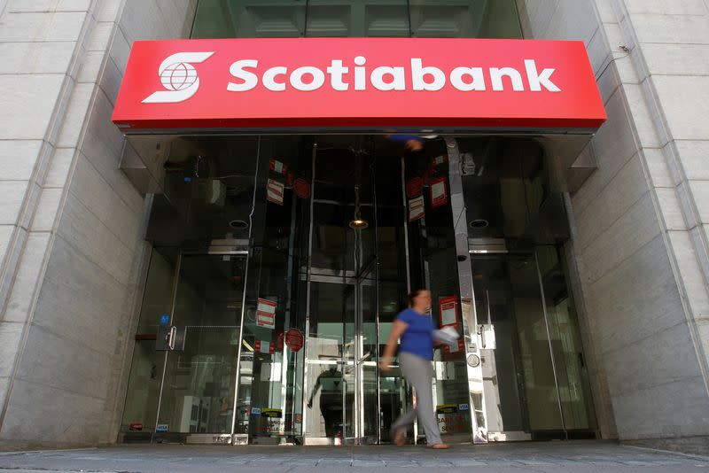FILE PHOTO: A woman leaves a Scotiabank branch in Ottawa