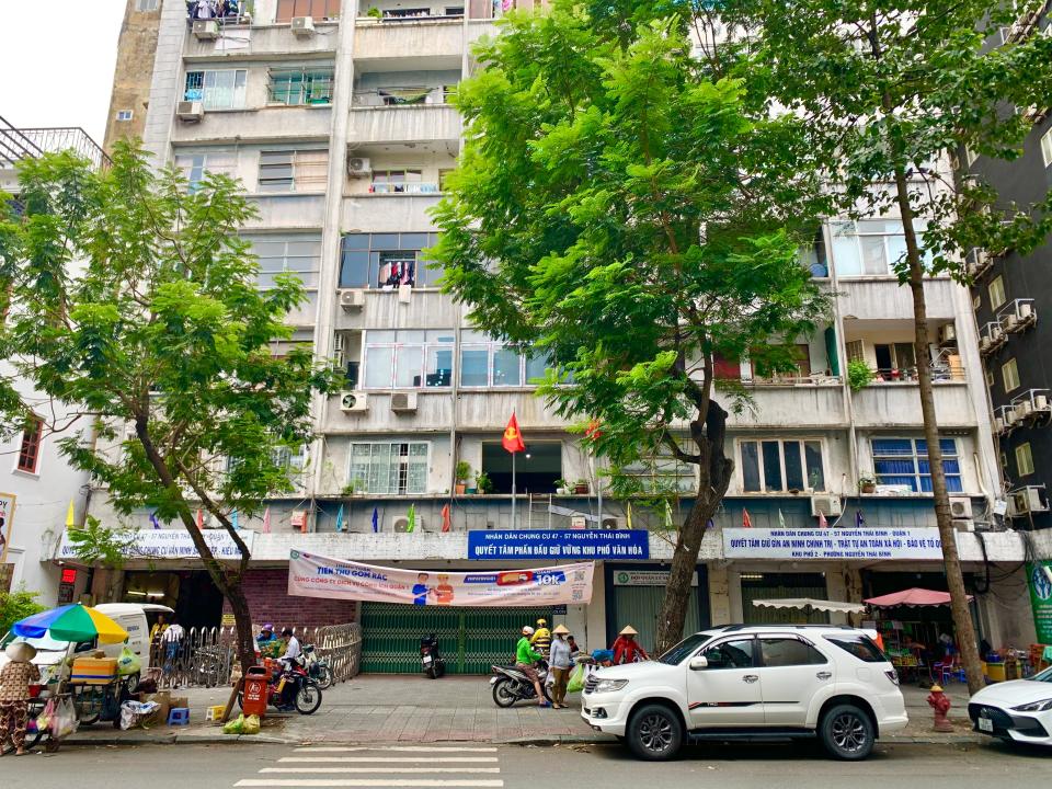 Ho Chi Minh City, Vietnam roadside with cars lining up the street