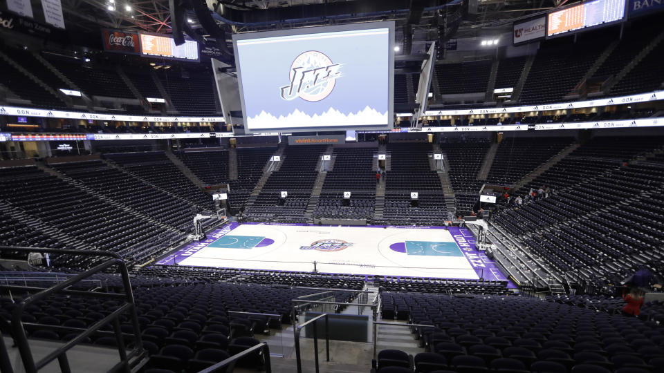 An empty Vivint Smart Home Arena is seen as the building was being evacuated because of a suspicious package following the Utah Jazz's NBA basketball game against the Golden State Warriors on Friday, Nov. 22, 2019, in Salt Lake City. Most fans had already left the building when players, coaches and reporters were instructed to leave the arena following Utah's 113-109 victory over the Warriors. (AP Photo/Rick Bowmer)