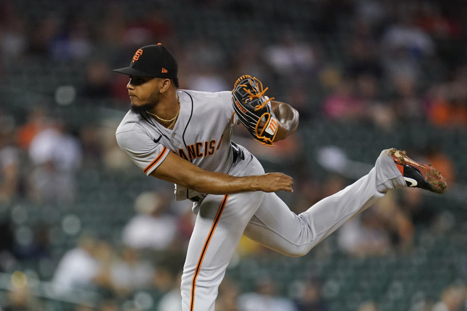 San Francisco Giants relief pitcher Camilo Doval (75) throws against the Detroit Tigers in the ninth inning of a baseball game in Detroit, Tuesday, Aug. 23, 2022. (AP Photo/Paul Sancya)