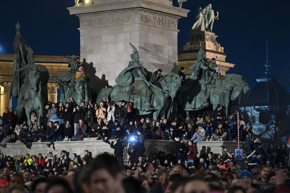 People attend a protest at Heroes' Square in Budapest, Hungary, Friday, Feb 16, 2024. Protesters demand a change in the country's political culture after the conservative head of state resigned amid scandal over a presidential pardon. (AP Photo/Denes Erdos)