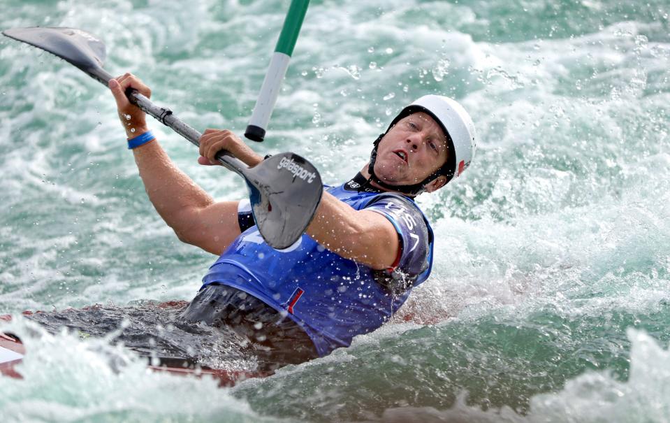 Tyger Vollrath moves under a gate in the men's kayak during 2024 Olympic Team Trials for Canoe/Kayak Slalom and Kayak Cross at the RIVERSPORT Whitewater Center in Oklahoma City, Friday, April 26, 2024.