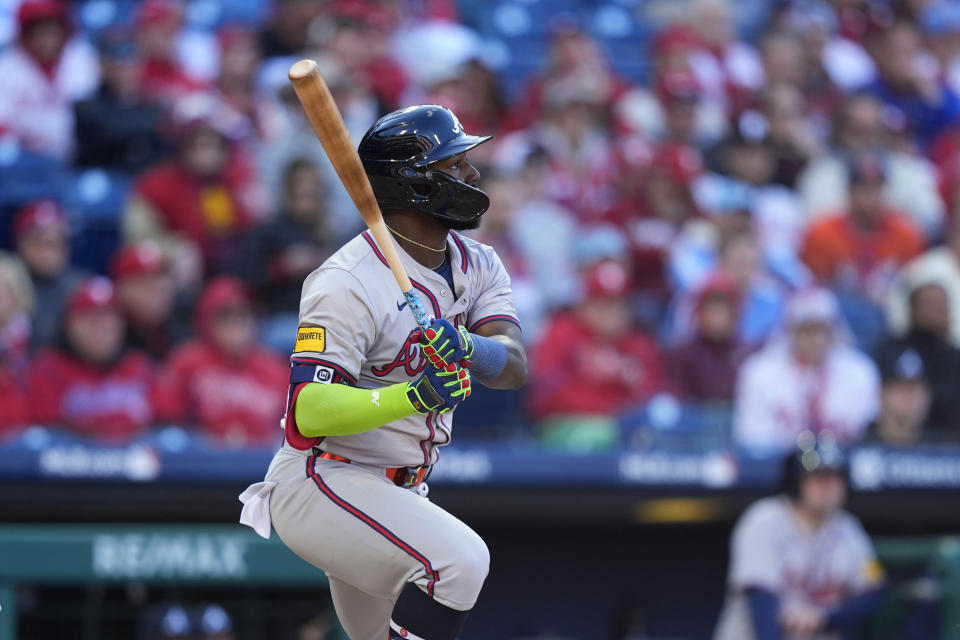 Atlanta Braves' Michael Harris II follows through after hitting a run-scoring single against Philadelphia Phillies pitcher Jose Alvarado during the eighth inning of an opening-day baseball game, Friday, March 29, 2024, in Philadelphia. (AP Photo/Matt Slocum)