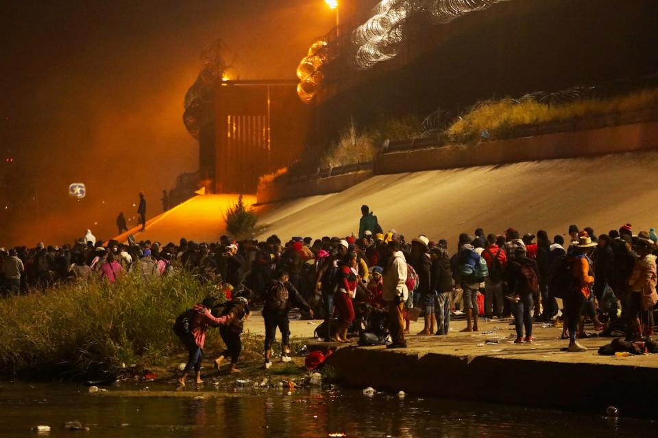 Migrants traveling in a caravan of more than 1,000 people wait in 2022 at the U.S.-Mexico border to file for political asylum in the U.S. <a href="https://www.gettyimages.com/detail/news-photo/migrants-travelling-in-a-caravan-of-more-than-a-thousand-news-photo/1245562490?phrase=mexico%20immigration&adppopup=true" rel="nofollow noopener" target="_blank" data-ylk="slk:Herika Martinez/AFP via Getty Images;elm:context_link;itc:0;sec:content-canvas" class="link ">Herika Martinez/AFP via Getty Images</a>