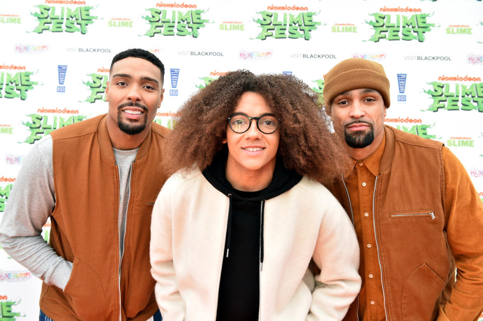 BLACKPOOL, ENGLAND - OCTOBER 19: (L-R) Jordan Banjo, Perri Kiely and Ashley Banjo of Diversity attend the Nickelodoen Slimefest at Blackpool Pleasure Beach on October 19, 2019 in Blackpool, England. (Photo by Shirlaine Forrest/Getty Images for Nickelodeon Slimefest)