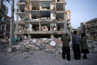 <p>In this photo provided by the Iranian Students News Agency, ISNA, people look at destroyed buildings after an earthquake at the city of Sarpol-e-Zahab in western Iran, Nov. 13, 2017.(Photo: Farzad Menati/Tasnim News Agency via AP) </p>