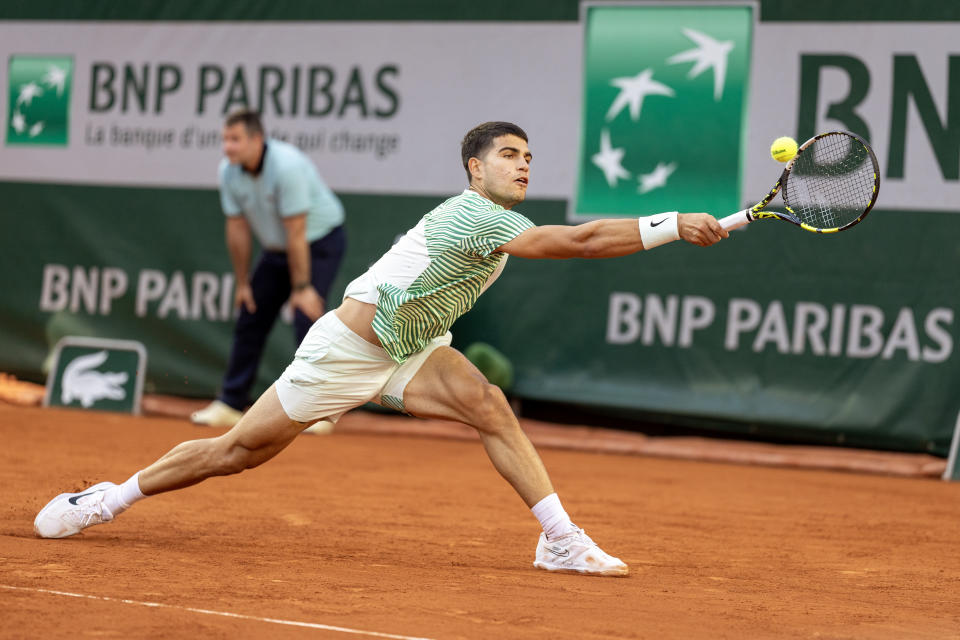 PARIS, FRANCE - MAY 29.  Carlos Alcaraz of Spain in action against Flavio Cobolli of Italy in the first round of the singles competition on the Suzanne Lenglen court during the French Open 2023 tennis tournament at Roland Garros on May 29, 2023, in Paris, France.  (Photo by Tim Clayton/Corbis via Getty Images)