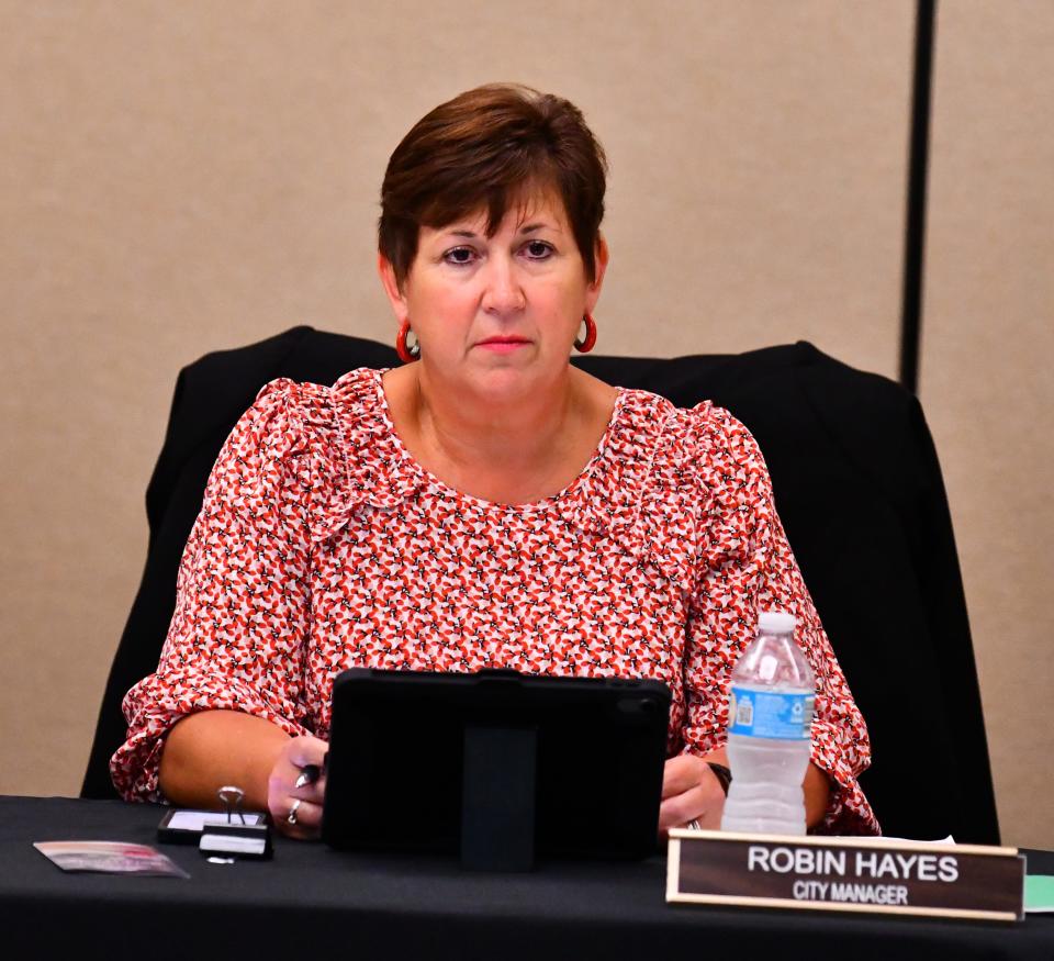 Cocoa Beach City Manager Robin Hayes listens during Thursday's Cocoa Beach City Commission meeting at the Cocoa Beach Country Club.