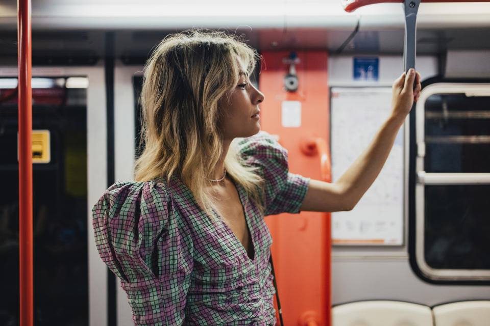 Stock picture of a woman on public transport, after news downblousing is to be made a criminal offence. (Getty Images)