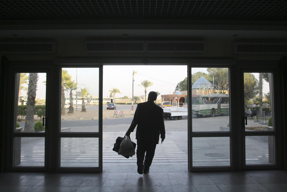 A Palestinian man arrives in Rafah after crossing into Gaza Strip from Egypt, Tuesday, Nov. 20, 2012. The $1.4 million terminal reflects a sign of Palestinian hopes that the fighting over the past week will end with a deal leading to an easier flow of people and goods into Egypt, which would transform their lives in the impoverished territory. It would also give Hamas a major victory that could help the Islamic group tighten its grip over Gaza's 1.7 million residents. (AP Photo/Eyad Baba)