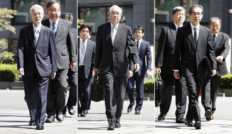 Tsunehisa Katsumata, Vice Presidents Sakae Muto and Ichiro Takekuro arrive at Tokyo District Court on Thursday. (AP)