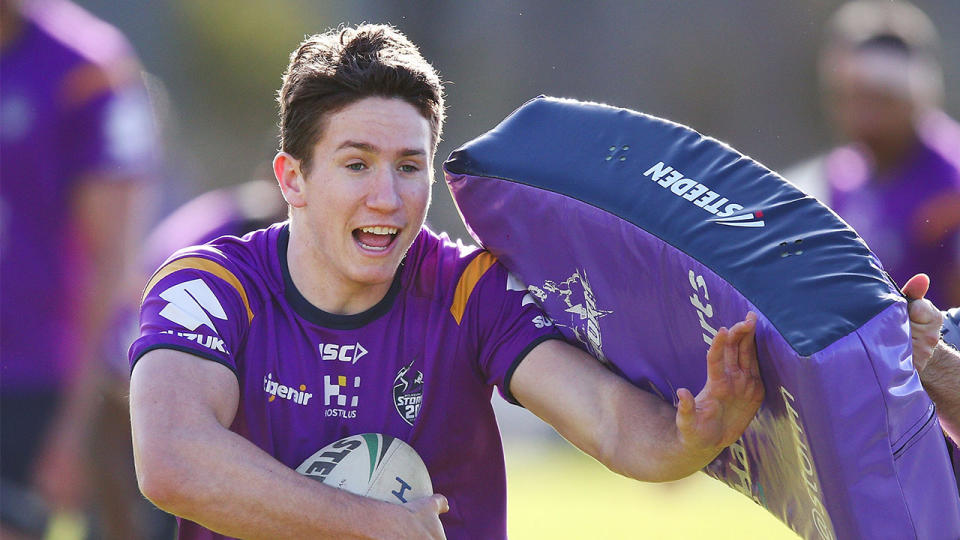 Cooper Johns runs with the ball during a Melbourne Storm NRL media opportunity at Gosch's Paddock on July 18, 2018 in Melbourne, Australia. (Photo by Michael Dodge/Getty Images)