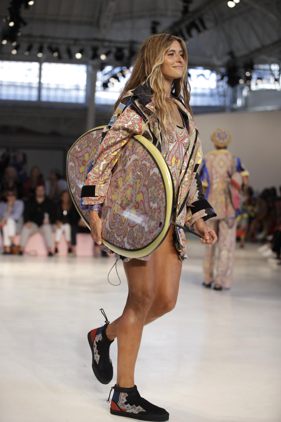 A model wears a creation as part of the Etro women's 2019 Spring-Summer collection, unveiled during the Fashion Week in Milan, Italy, Friday, Sept. 21, 2018. (AP Photo/Luca Bruno)