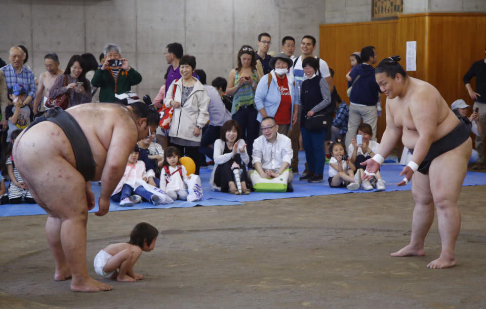 Playing sumo wrestling