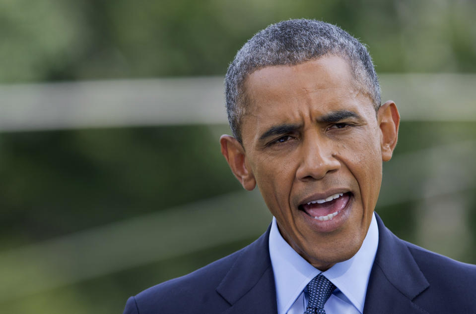 President Barack Obama announces new economic sanctions against key sectors of the Russian economy on the South Lawn of the White House in Washington in July 2014. (Photo: Manuel Balce Ceneta/AP)