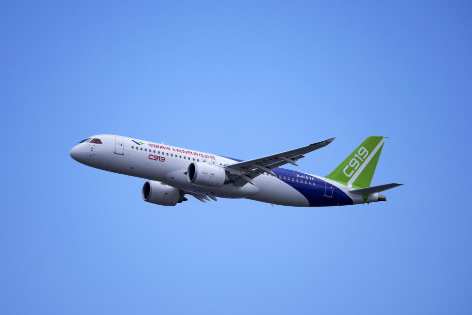 A China's Comac C919 aircraft performs during first day of Singapore Airshow in Singapore, Tuesday, Feb. 20, 2024. The Singapore Airshow – Asia’s largest – kicked off Tuesday with an array of aerial displays including some by China’s COMAC C919 narrow-body airliner.(AP Photo/Vincent Thian)
