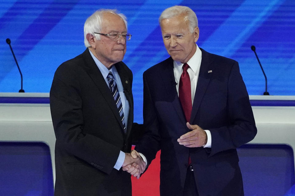 Democratic presidential candidates Sen. Bernie Sanders, I-Vt., left, and former Vice President Joe Biden greet each other Thursday, Sept. 12, 2019, before a Democratic presidential primary debate hosted by ABC at Texas Southern University in Houston. (AP Photo/David J. Phillip)