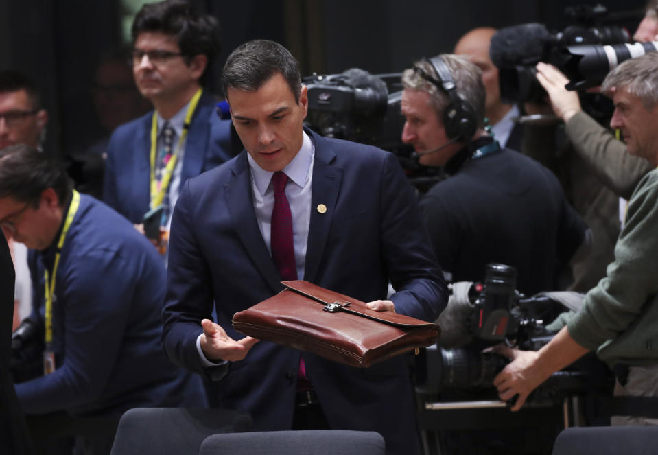 Spanish Prime Minister Pedro Sanchez, center, arrives for a round table meeting at an EU summit in Brussels, Thursday, Dec. 12, 2019. European Union leaders gather for their year-end summit and will discuss climate change funding, the departure of the UK from the bloc and their next 7-year budget. (AP Photo/Francisco Seco)