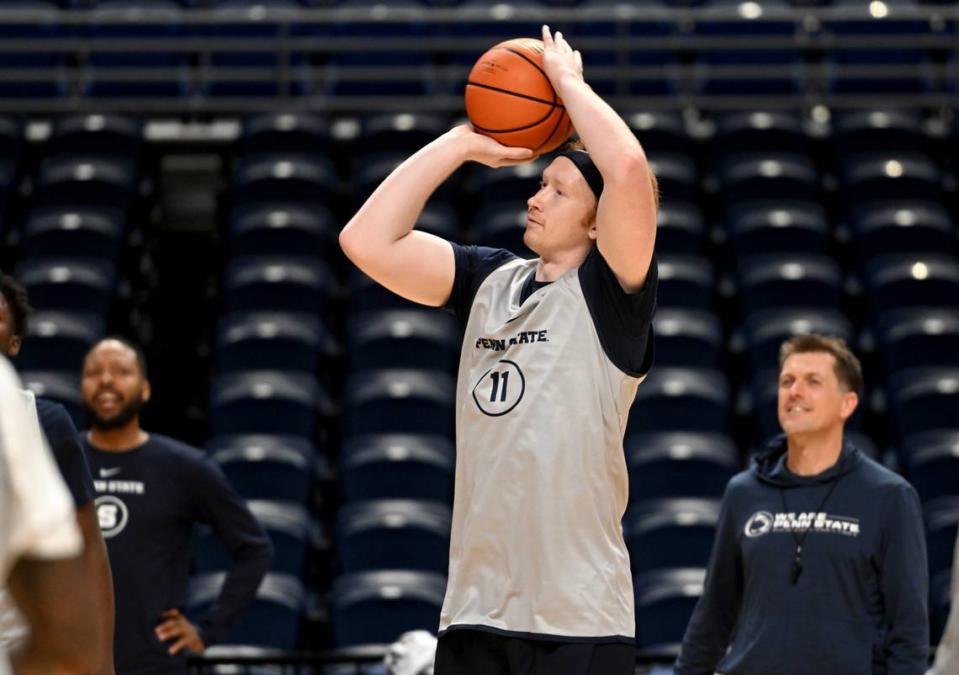 Coaches and teammates cheer on Leo O’Boyle as he makes threes point shots during Penn State men’s basketball practice on Monday, Oct. 23, 2023.