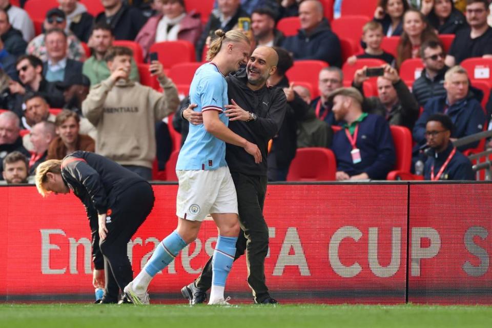 Pep Guardiola with Erling Haaland during the semi-final against Sheffield United at Wembley