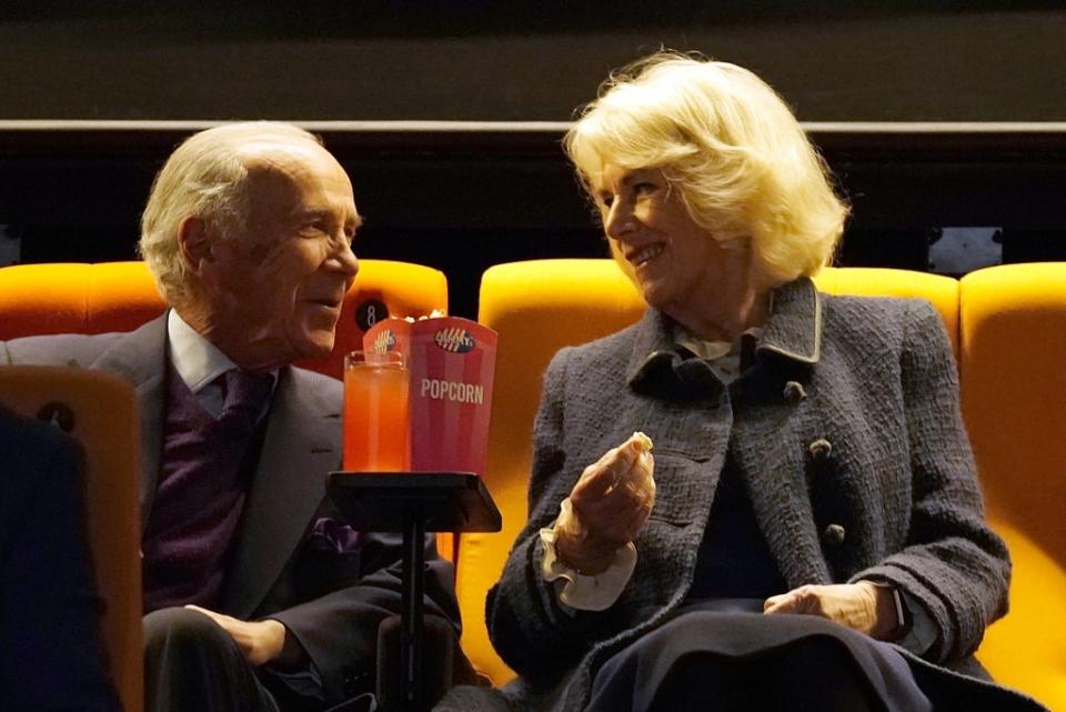 The Duchess of Cornwall enjoys popcorn alongside philanthropist Robert Hiscox (PA) (PA Wire)