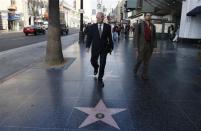 Shareholder activist John Chevedden, 67, (L) exits the subway on his way to the DreamWorks Animation SKG Inc stockholder meeting in Hollywood, California May 29, 2013. REUTERS/Lucy Nicholson