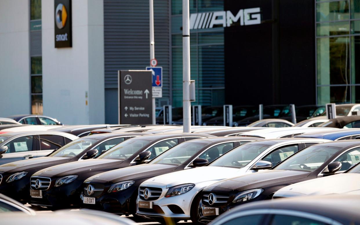 Car showrooms are set to reopen tomorrow - Adrian Dennis/AFP